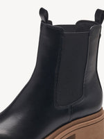 Black ankle boot with beige sole