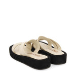 Slippers with raised sole in leather with white or tan crossed bands