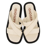 Slippers with raised sole in leather with white or tan crossed bands