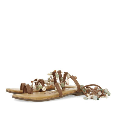 Sandal with stones along all the laces